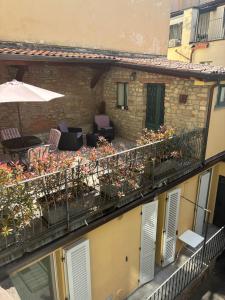 a balcony with chairs and plants on a building at La Casa nel Borgo in Bergamo