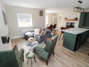 a living room with a couch and a table at Red House in Galway
