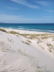 a sandy beach with the ocean in the background at HERGLA Sousse Zone Touristique in Harqalah