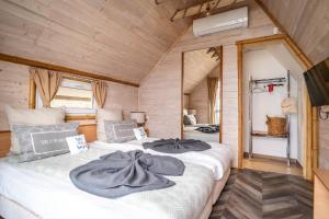a bedroom with a large bed in a room at Къщички Синьо лято, Черноморец - Варна - Blue Summer Houses Varna in Varna City