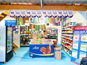 a store with a lot of products on display at De BOUGENVILLE Tulap Beach Front in Watulanei
