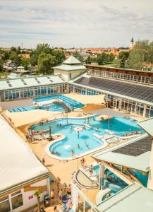 an overhead view of a large swimming pool on a building at Óvár Apartman in Mosonmagyaróvár