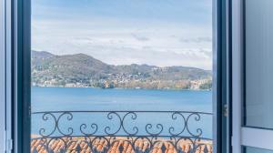 a view of a lake from a window at LEtoile du Lac in Blevio