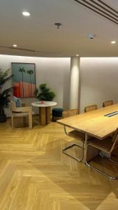 an office with wooden floors and tables and chairs at Phyll Condominium Luxury 301 2bedroom, Phuket in Ban Rangeng +64 photos