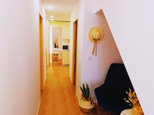 a hallway with a room with white walls at Refúgio Brisa Mar in Vila do Conde