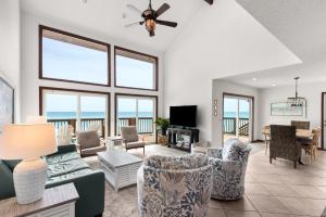 a living room with a view of the ocean at Sun 'n Surf in Inlet Beach