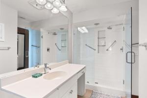 a white bathroom with a sink and a shower at Sun 'n Surf in Inlet Beach +58 photos