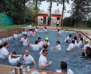 a group of people in a swimming pool at Brown oak farms in Sohna +23 photos