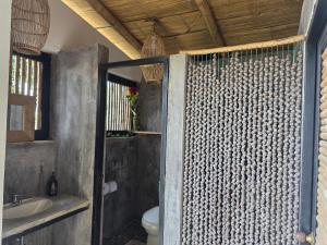 a bathroom with a shower with a toilet and a sink at Refugio cerca a Villeta in Petaqueros +151 photos