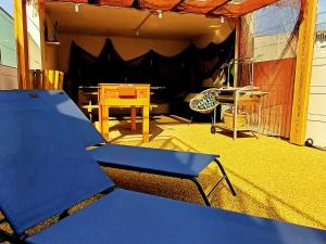 a view of a patio with a table and a tent at Refúgio Brisa Mar in Vila do Conde +6 photos