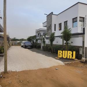 a building with a sign that says burn on it at Villa burj in Ngaparou