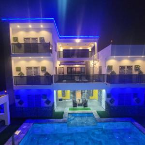 a house with a swimming pool at night at Villa burj in Ngaparou