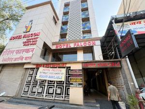 a man standing in front of a hotel liaison at Hotel Falcon Ulhasnagar by Hotelist in Kalyan