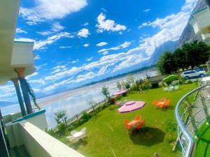 a balcony with a view of the water at Hotel Blangsa Indus View in Skardu
