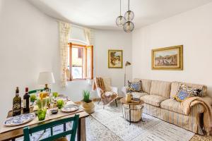 a living room with a couch and a table at Tuscan Treasure Tower in Colle di Val d'Elsa