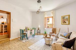 a living room with a couch and a table at Tuscan Treasure Tower in Colle di Val d'Elsa +18 photos
