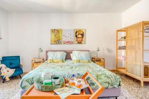 a bedroom with a bed with a tray of food on it at Tuscan Treasure Tower in Colle di Val d'Elsa