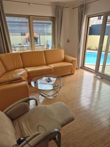 a living room with a couch and a table at Villa Aria in Marčana