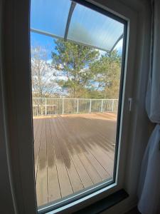 a window with a view of a deck at Jena Ferienwohnung Campusblick in Jena