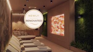 a lobby with a newxy rewarded sign on the wall at Remisens Hotel LUCIJA in Portorož +47 photos