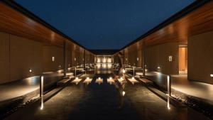 a hallway of a building at night with lights at Mungyeong Sadamjae Stay in Mungyeong