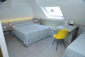 Postel nebo postele na pokoji v ubytování Hotel Astoria