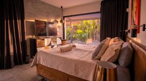 a bedroom with a bed with two stuffed animals on it at Villa Ha Taew in Sant Josep de sa Talaia +87 photos
