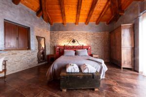 a bedroom with a bed with two towels on it at Casa Vecchia Bed&Breakfast in Bossolasco