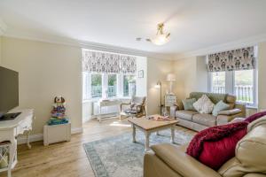 a living room with a couch and a table at 3 Bed in Langholm oc-c41365 in Langholm