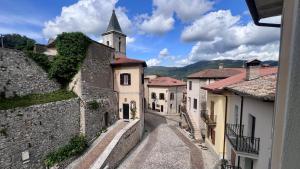 an alley in a town with a church at Casa Vacanze "La Casetta" in Configni