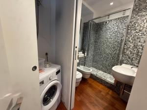 a bathroom with a sink and a toilet and a shower at Mare Mosso 1 in Manarola
