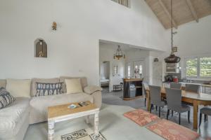 a living room with a couch and a table at Villa Pilali in Kefallonia