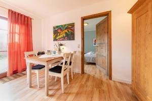a kitchen and dining room with a table and chairs at Windrose 08 in Ahrenshoop