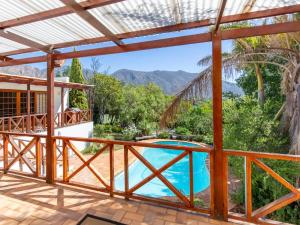 a view from the balcony of a villa with a swimming pool at The Gentleman in Montagu