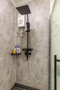 a shower in a bathroom with a shower at Coolplay house in Bangkok
