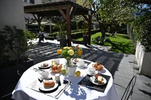 a white table with food on top of it at Hotel Les Terrasses in Annecy +59 photos