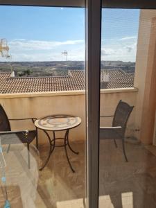 a view from a balcony with a table and chairs at Casa Ingrid in San Fulgencio