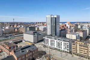 an aerial view of a city with tall buildings at Luminary - Tampere City Center Apartments by Come in! in Tampere +18 photos