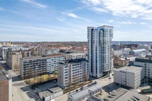 an aerial view of a city with tall buildings at Luminary - Tampere City Center Apartments by Come in! in Tampere