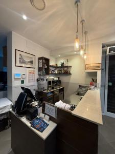 a kitchen with a counter and a kitchen with a stove at Tesorella guest house in Cassano dʼAdda
