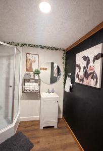 a bathroom with a sink and a mirror at Western Studio in Houston
