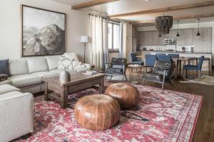 a living room with two large pumpkins on a rug at Mountain Lake Condo - Unit 401B in Big Sky