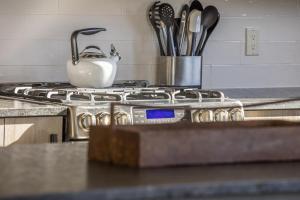 a stove top with a tea pot on top of it at Mountain Lake Condo - Unit 502B in Big Sky