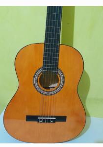 a guitar sitting on top of a table at سيدي رحال الشاطئ in Sidi Rahal