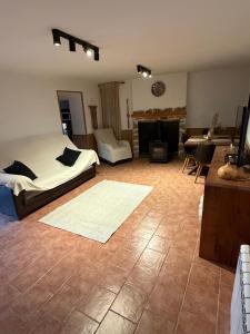 a bedroom with a bed and a living room at Casa Rural La Abejuela in Abejuela