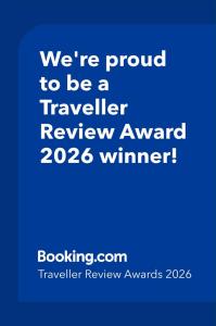 a blue text box with the words were proud to be a traveller reviewanu at Charming Chamber with spacious relaxing area in Pagham