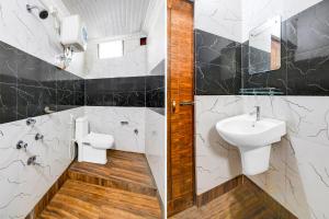 a bathroom with a sink and a toilet at Super Hotel O Chilapata Forest Formerly Moner Manush Homestay in Uttar Simlabari