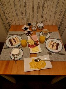 a table with plates of food on top of it at Pension Müller in Barweiler +2 photos