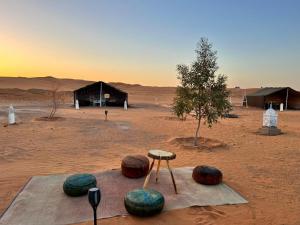 a group of spheres in the middle of a desert at Sahara Standard Camp in Merzouga +14 photos
