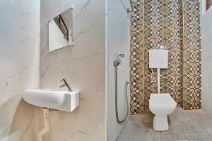 a bathroom with a sink and a toilet at Super Hotel O Erode Bus Stand in Erode